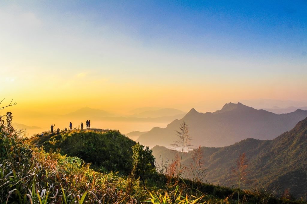 Services Photo Of People Standing On Top Of Mountain Near Grasses 733162 1024x682